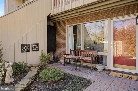 a backyard of a house with outdoor seating