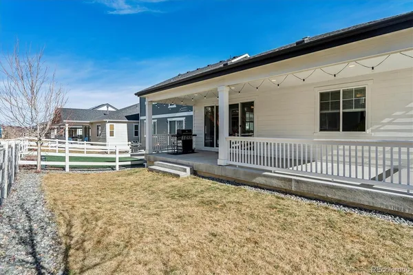 a view of a house with wooden fence