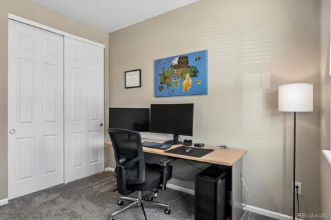 a view of a workspace with furniture