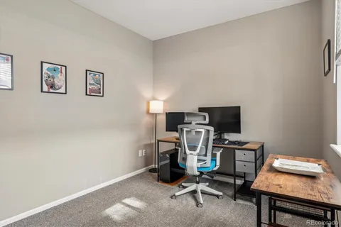a view of a workspace with furniture