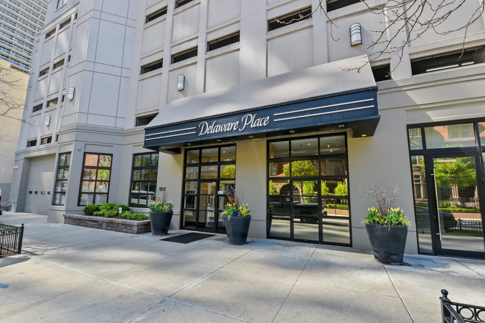 a front view of a building with potted plants