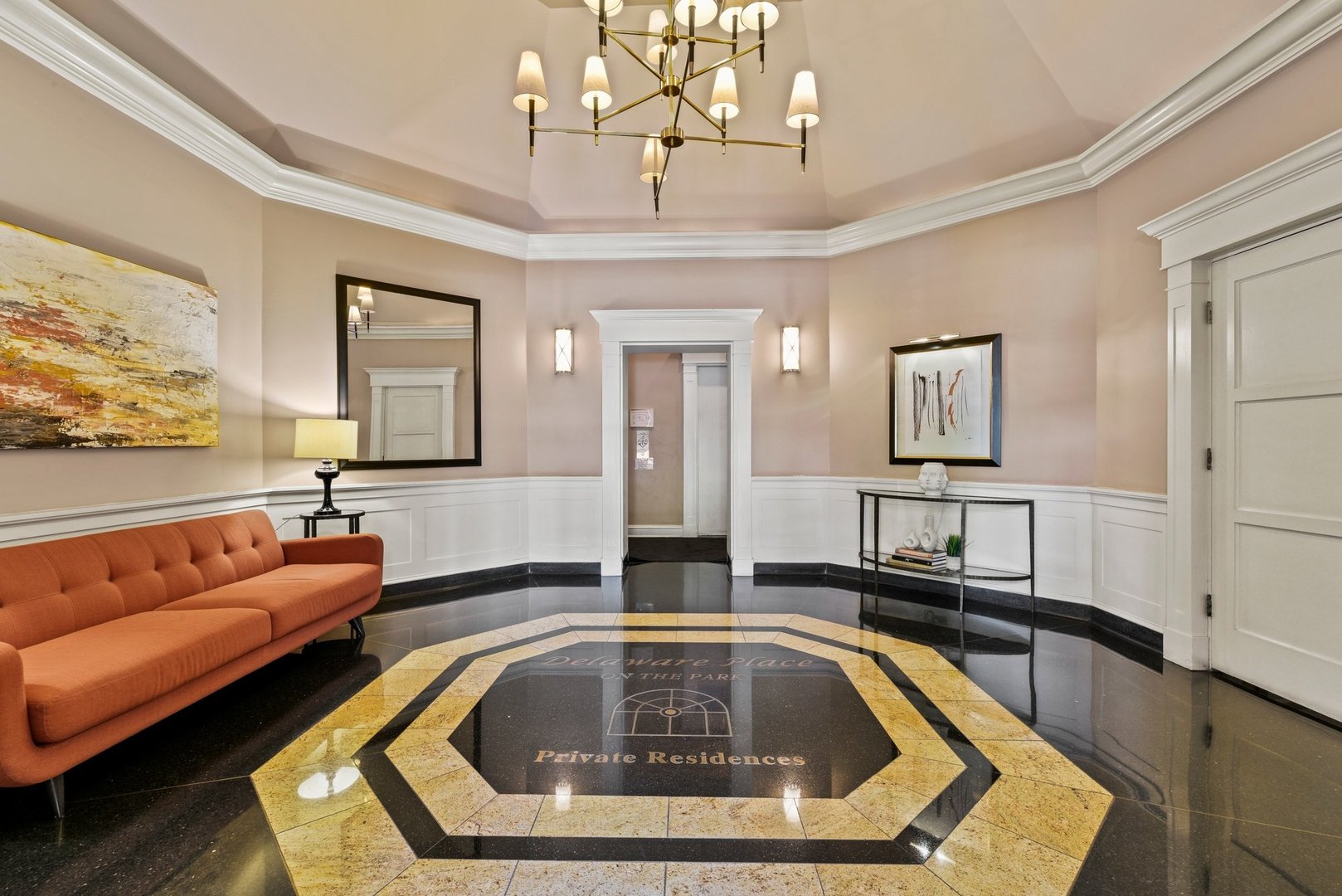 33 West Delaware Place, Unit 23D Chicago, IL 60610 - Photo 2 of 20 a living room with furniture and a chandelier