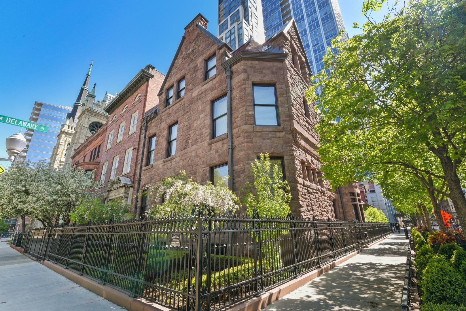 33 West Delaware Place, Unit 23D Chicago, IL 60610 - Photo 19 of 20 a city view with a brick house in the background