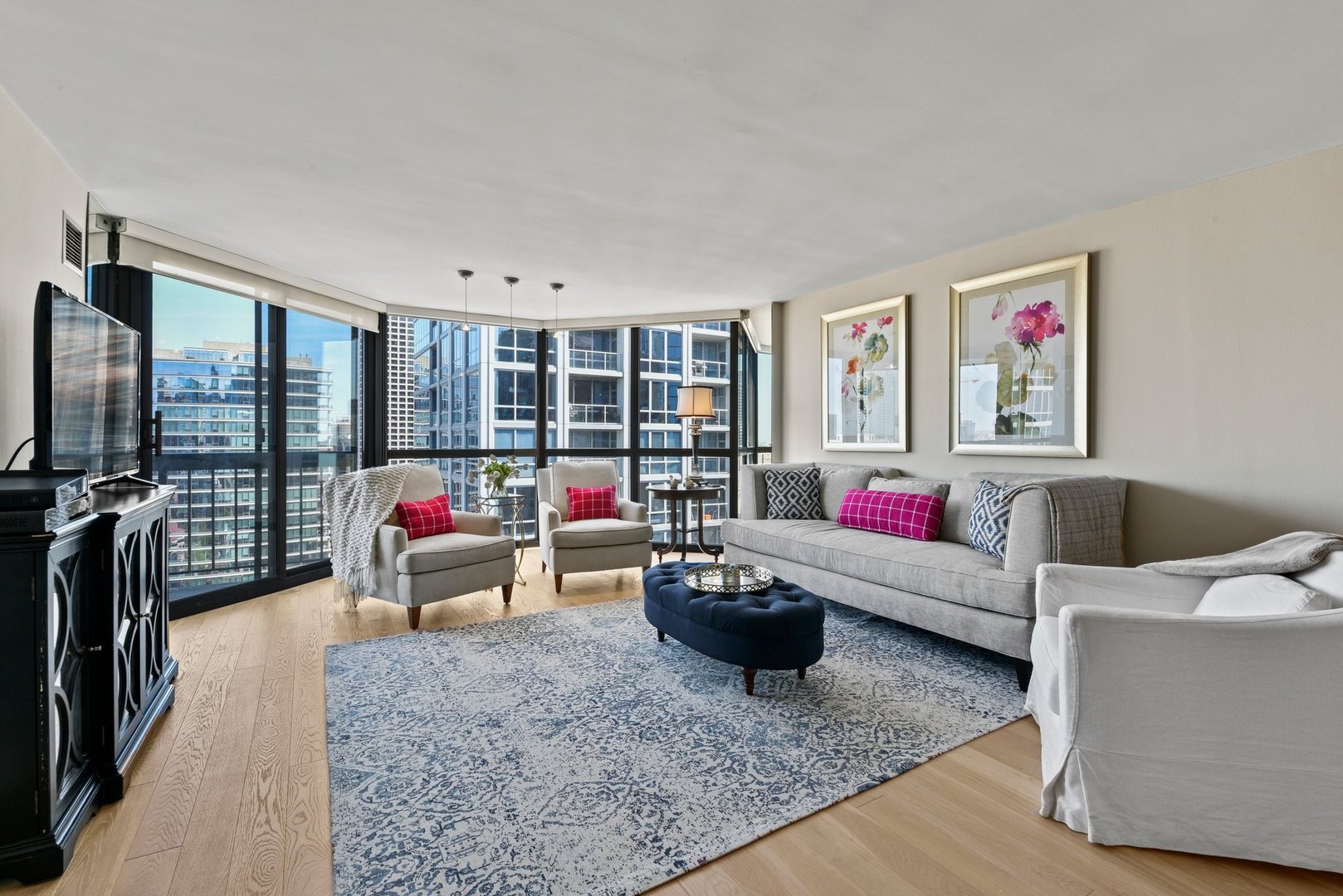 33 West Delaware Place, Unit 23D Chicago, IL 60610 - Photo 3 of 20 a living room filled with furniture and a floor to ceiling window