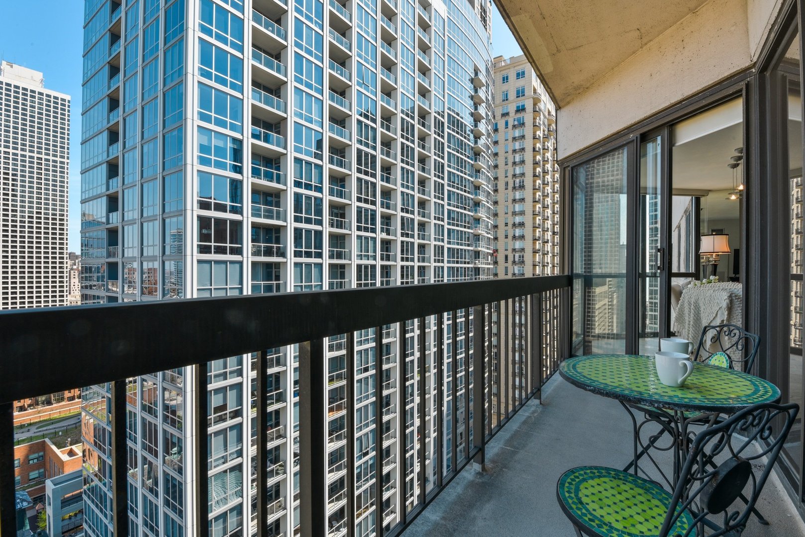 33 West Delaware Place, Unit 23D Chicago, IL 60610 - Photo 7 of 20 a view of a balcony with chairs