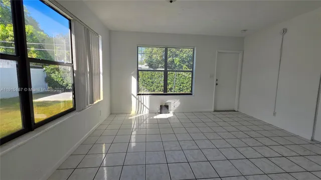 a view of an empty room and window