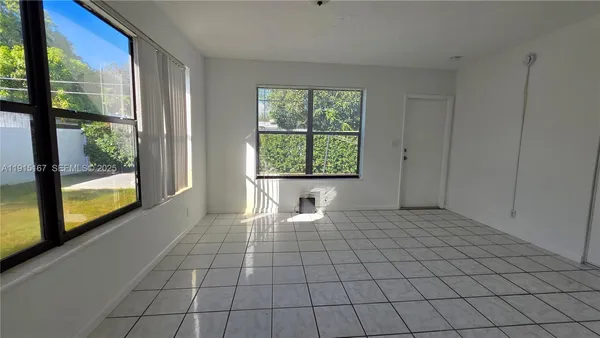 a view of an empty room and window