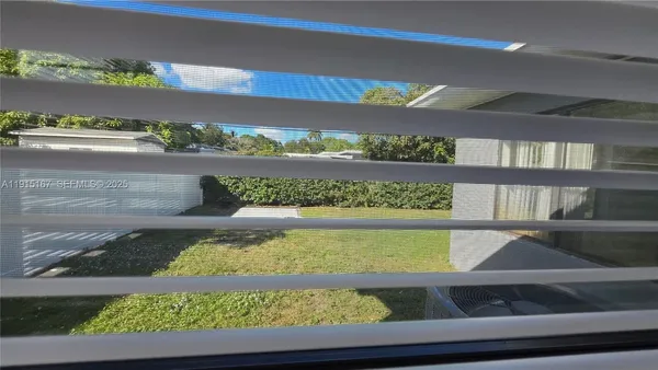 a view of swimming pool from a window