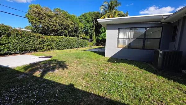 a view of a backyard of the house