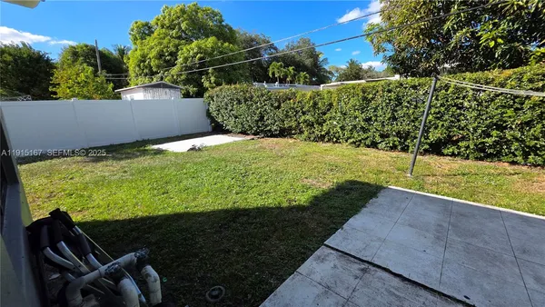 a view of outdoor space and yard