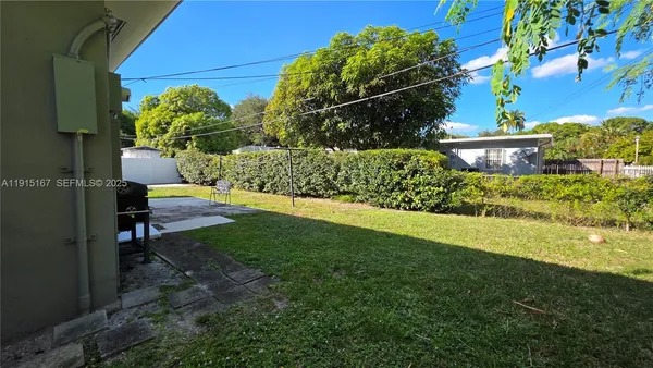 a view of a backyard with plants