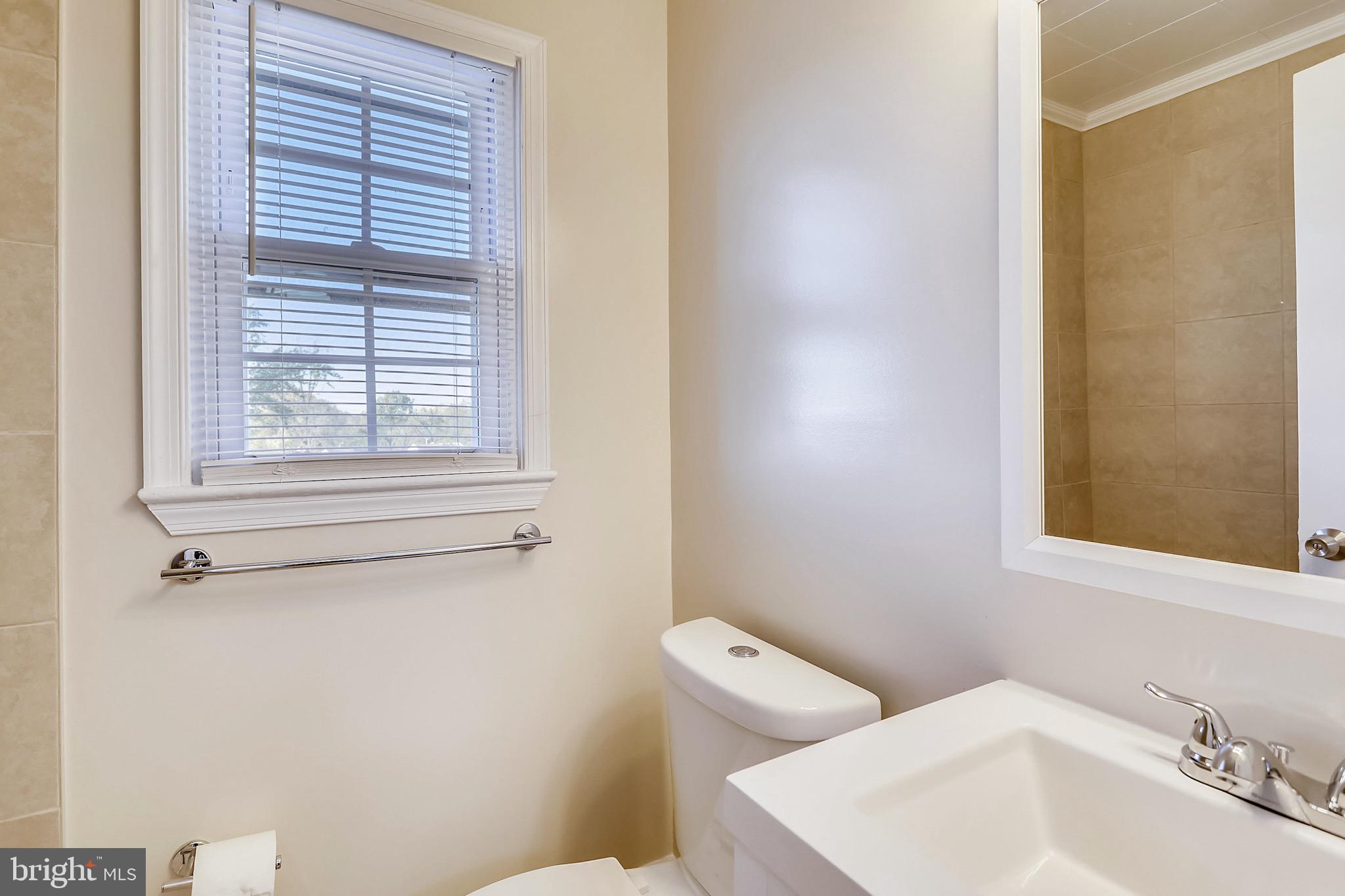 12014 Claridge Road Silver Spring, MD 20902 - Photo 20 of 28 Full renovated bathroom w/ tub on the upper level.
