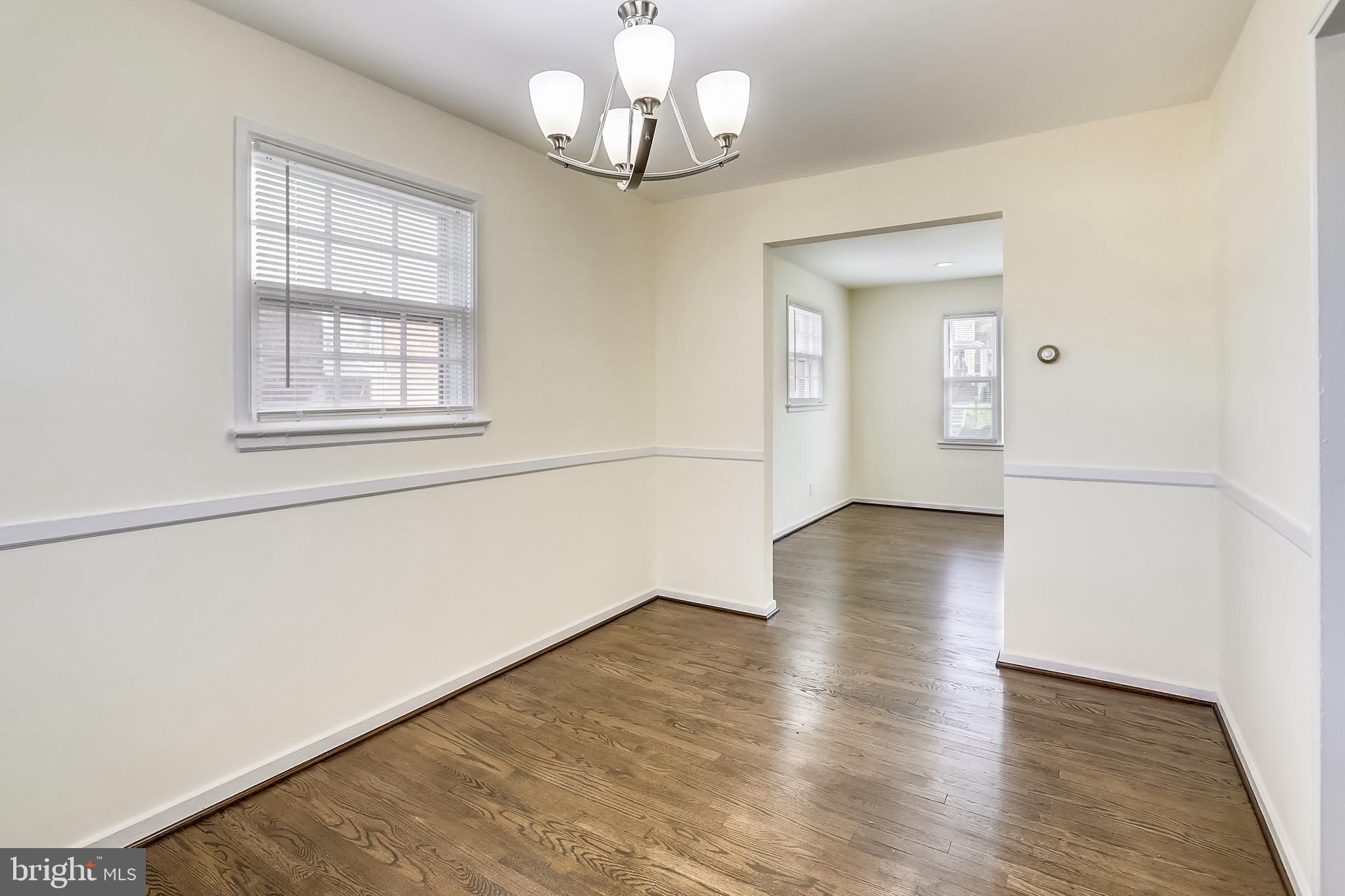 12014 Claridge Road Silver Spring, MD 20902 - Photo 8 of 28 Dining room with new chandelier and chair rail.
