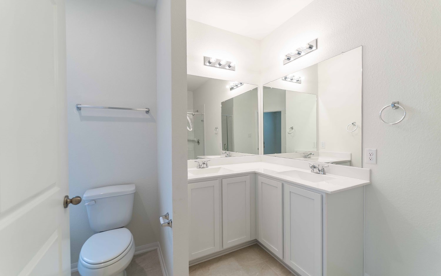 10656 Altitude Way Conroe, TX 77303 - Photo 12 of 30 a bathroom with a toilet a sink and mirror