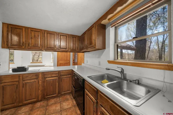 a kitchen with a sink and cabinets