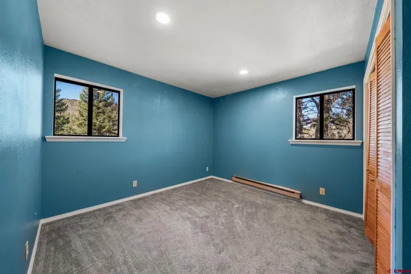 a view of room with window and ceiling fan