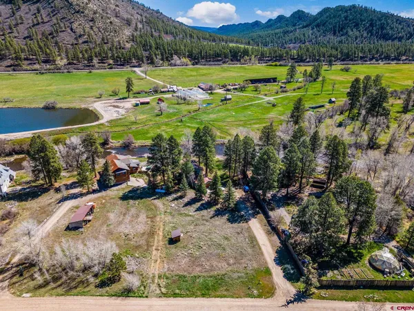 a view of a golf course with a swimming pool
