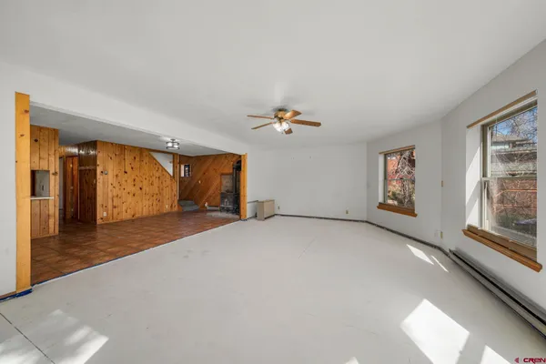a furnished livingroom with a window