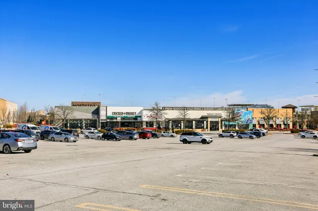 a view of cars parked on the side of a street
