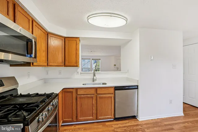 a kitchen with a stove and a microwave