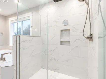 a bathroom with a shower and a mirror