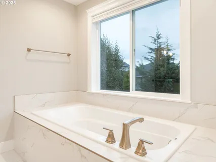 a bath tub sitting next to a window