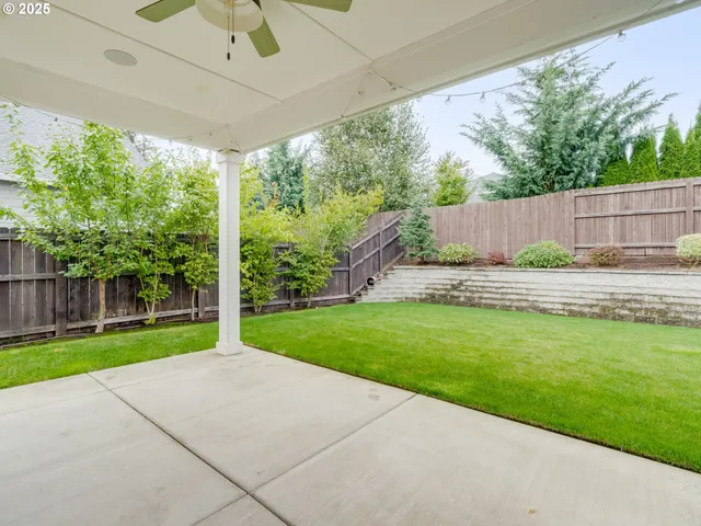 a backyard of a house with lots of green space