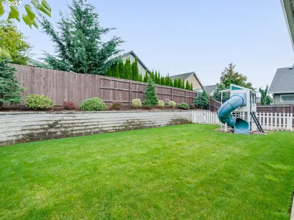 a childrens park with lots of swings and slides