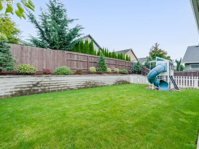 a childrens park with lots of swings and slides