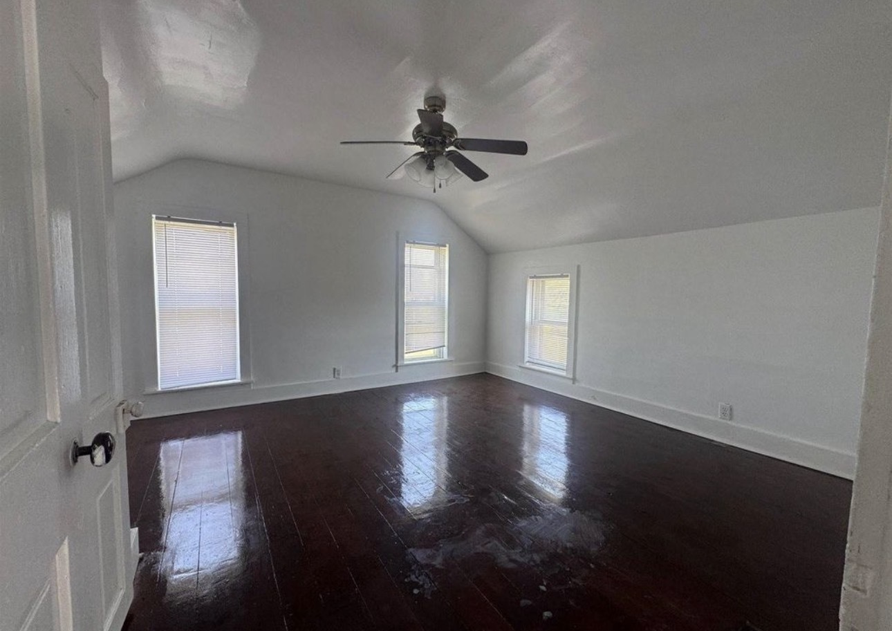 302 Coeburg Street Rio, IL 61472 - Photo 16 of 22 an empty room with wooden floor fan and windows