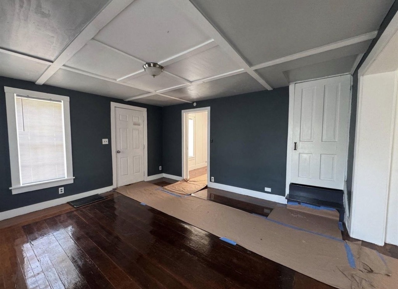 302 Coeburg Street Rio, IL 61472 - Photo 6 of 22 a view of an empty room with a window and wooden floor