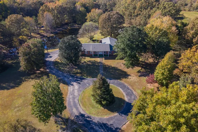 a view of a swimming pool with a patio