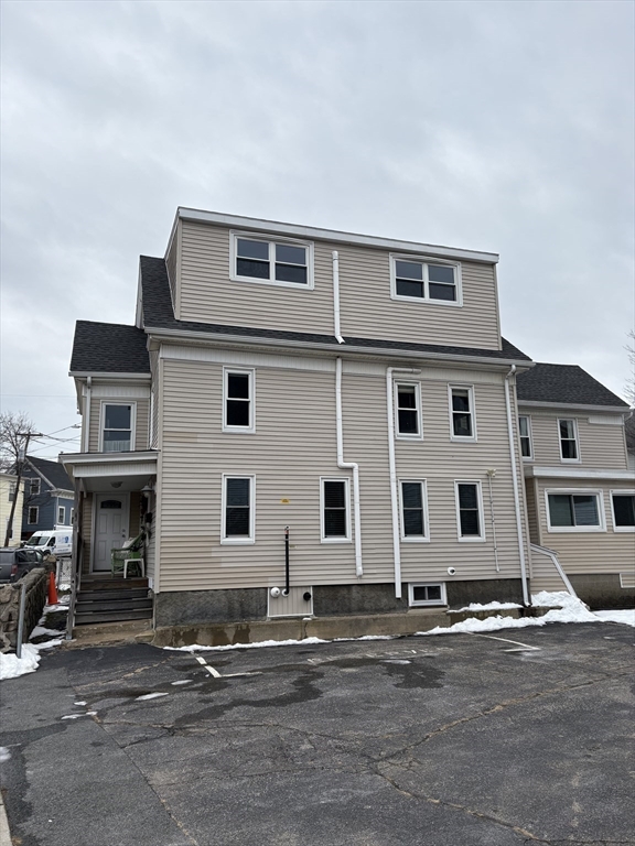 97 Washington Street, Unit 3 Gloucester, MA 01930 - Photo 15 of 15 a front view of residential houses with street