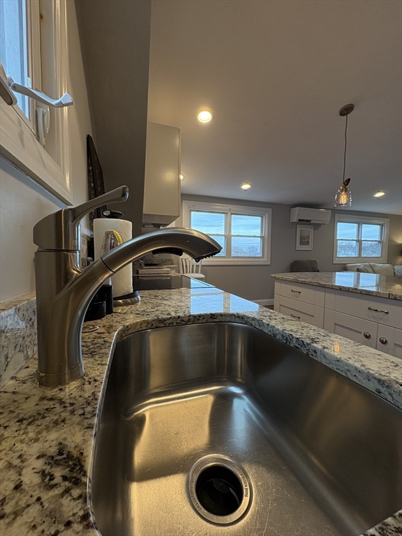 97 Washington Street, Unit 3 Gloucester, MA 01930 - Photo 7 of 15 a kitchen with a sink and a stove