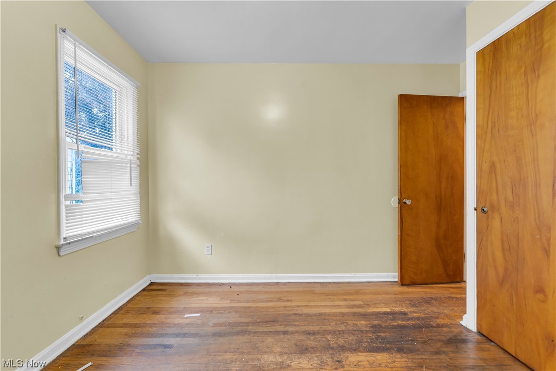 5619 Dunham Road Maple Heights, OH 44137 - Photo 10 of 19 Unfurnished room with dark hardwood floors