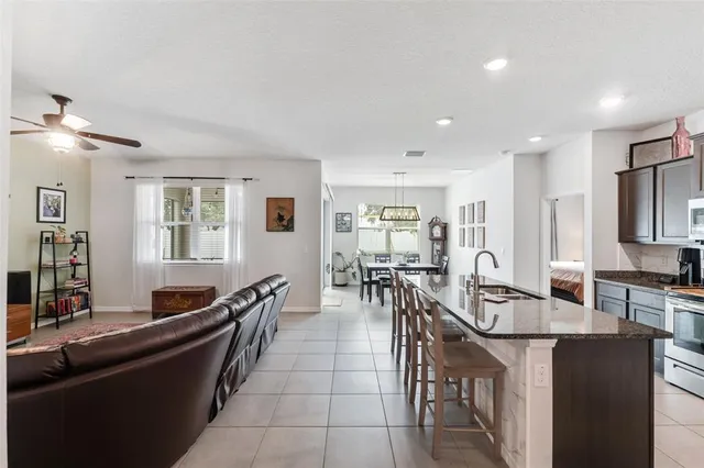 a kitchen with living room and furniture