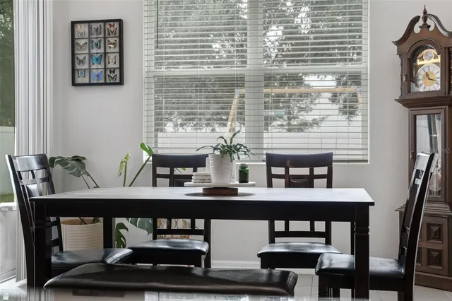 a dining room with table and chairs