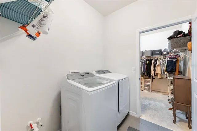 a utility room with dryer and washer
