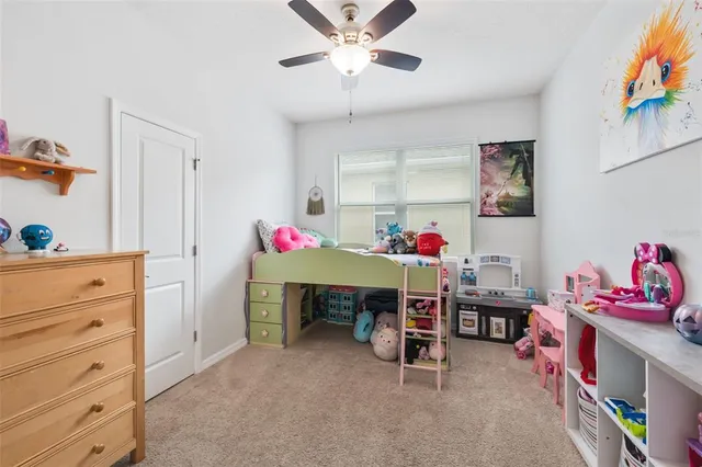 a workspace with furniture and baby bed