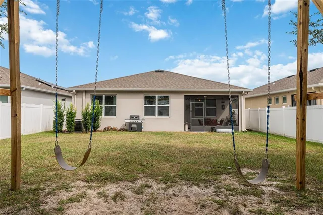 a backyard of a house with lots of green space
