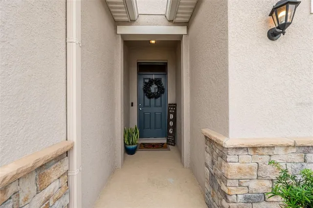 a view of a hallway with wooden shelves
