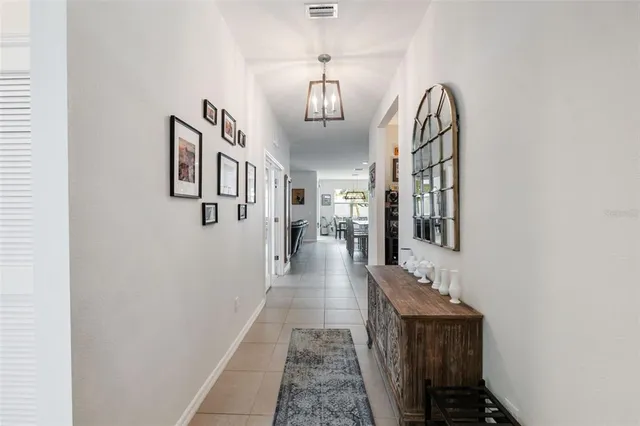 a view of a hallway with windows