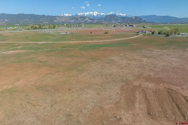 a view of an ocean and a mountain