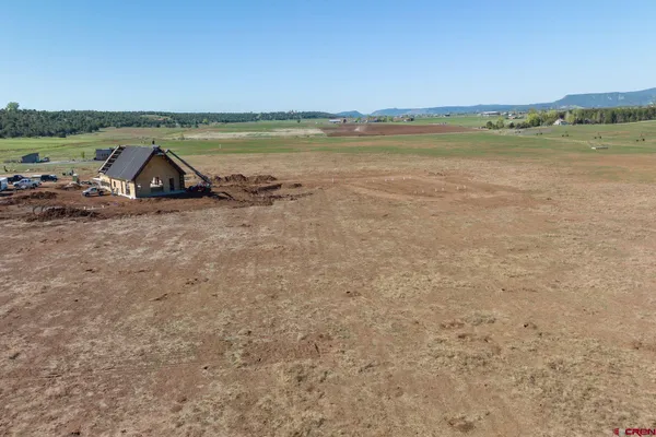 a view of lake and mountain in background
