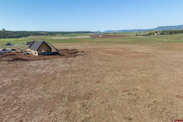 a view of lake and mountain in background