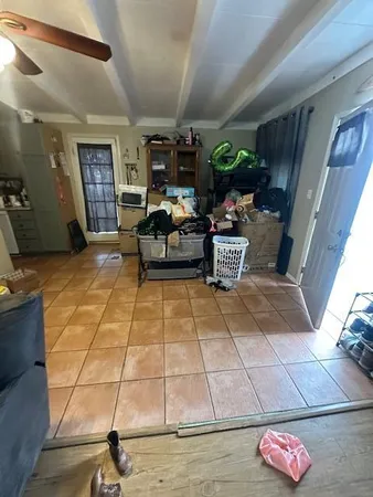 a kitchen with stainless steel appliances granite countertop a refrigerator a stove and a sink with wooden floor