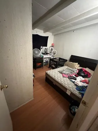 a bedroom with bed and a closet