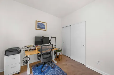 a view of workspace with wooden floor lounge chair