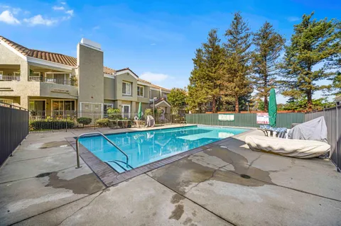 a view of a building with a yard