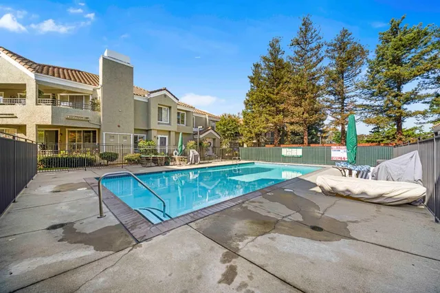 a view of a building with a yard